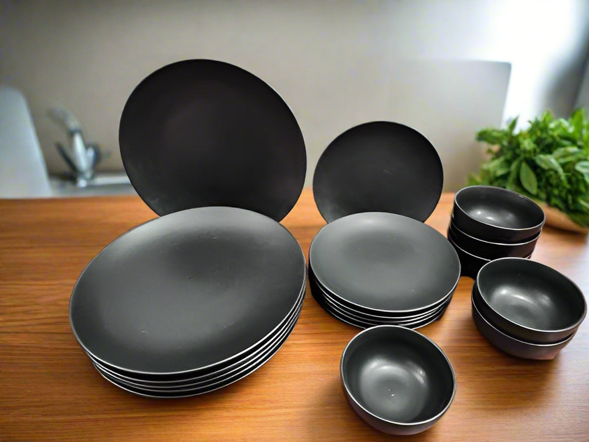 18-piece black ceramic matte finish dinnerware set with plates and bowls