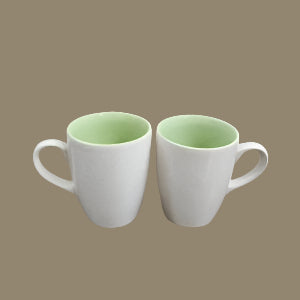 Two plain white and green ceramic cups, 250 ml each, ideal for gifting.
