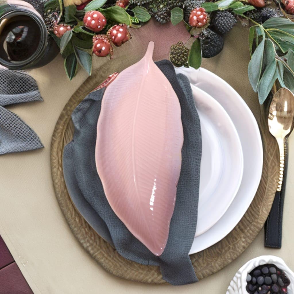 ceramic serving platters of different shapes & sizes  styled with gold cutlery 