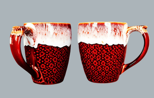 Two red ceramic mugs with a textured surface , perfect for gifting